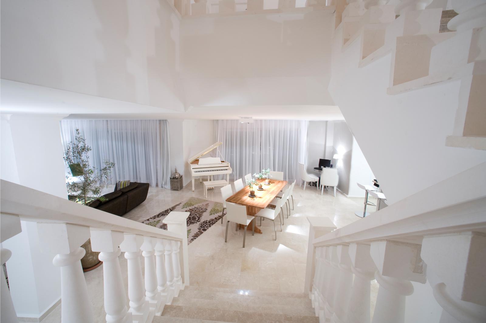 Stairs lead down to the open plan lounge, diner and kitchen